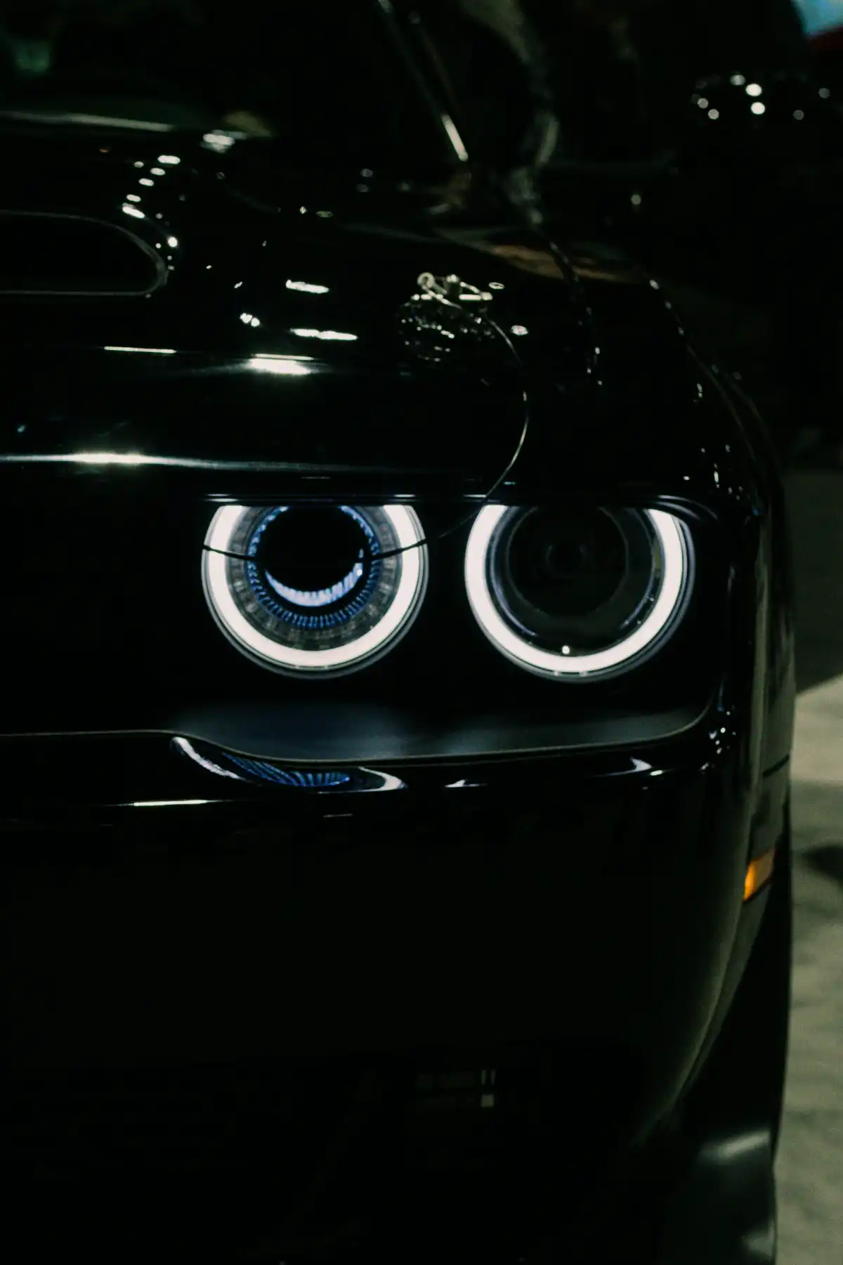 a close up of a black car with two eyes