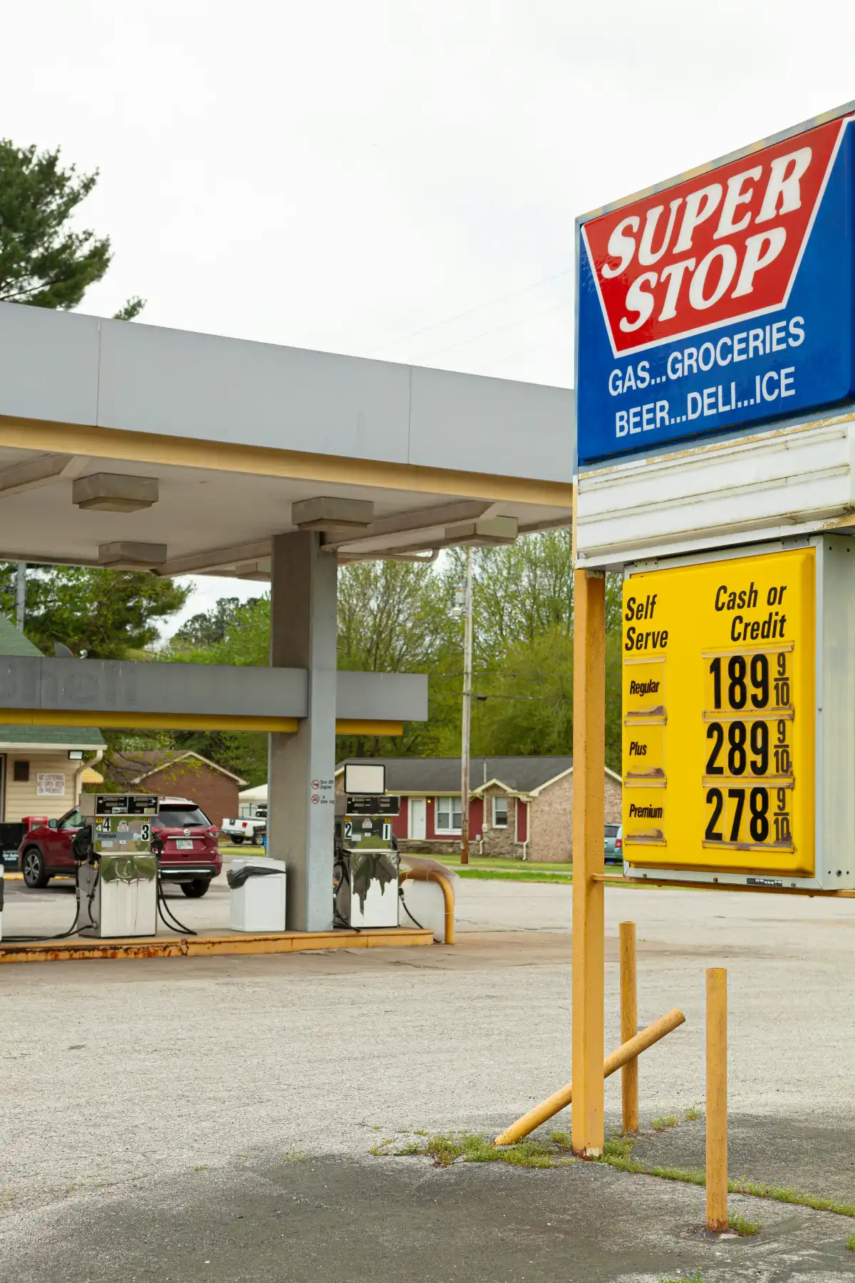 red and black metal chair near yellow and blue store