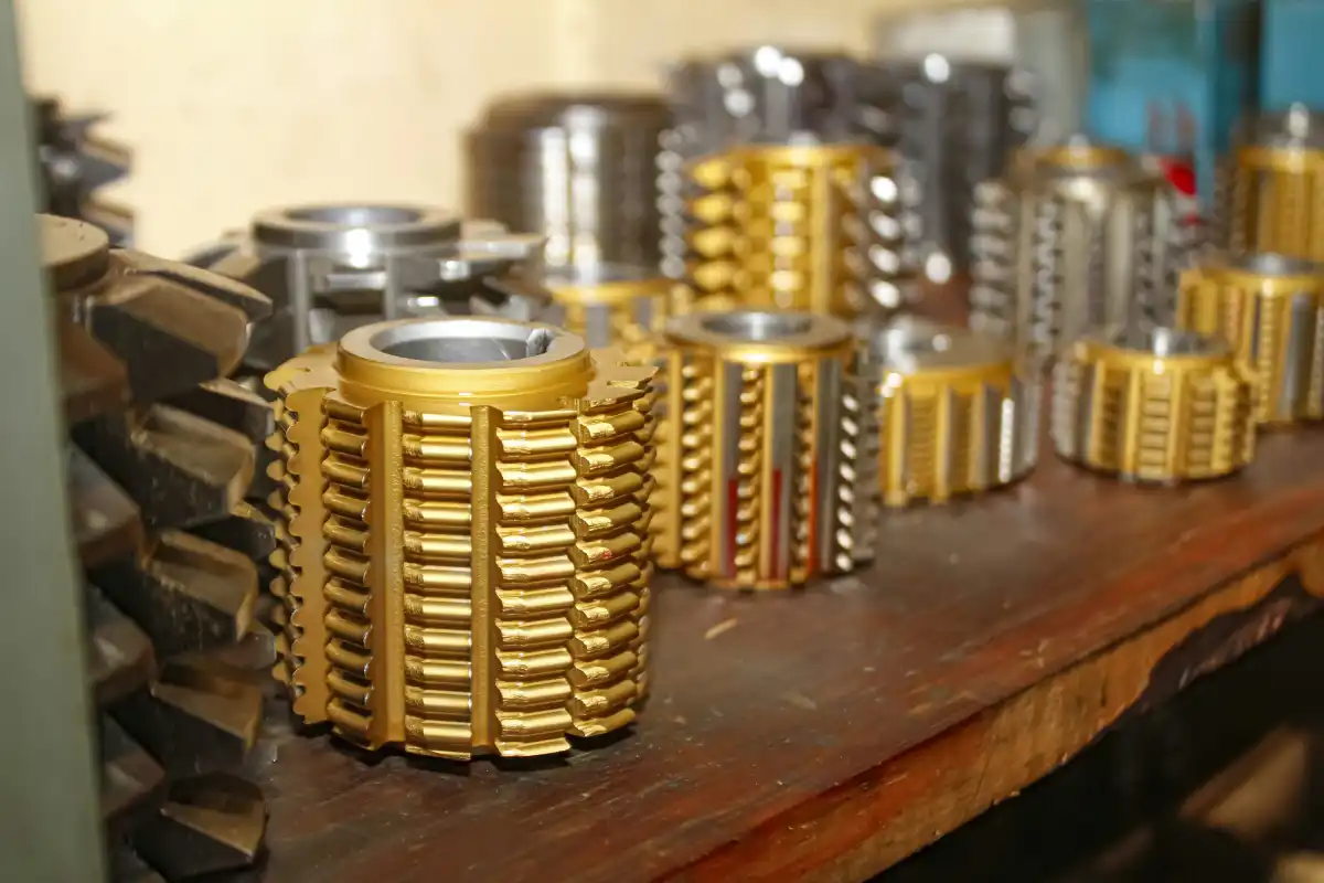 A table topped with lots of gold and silver objects