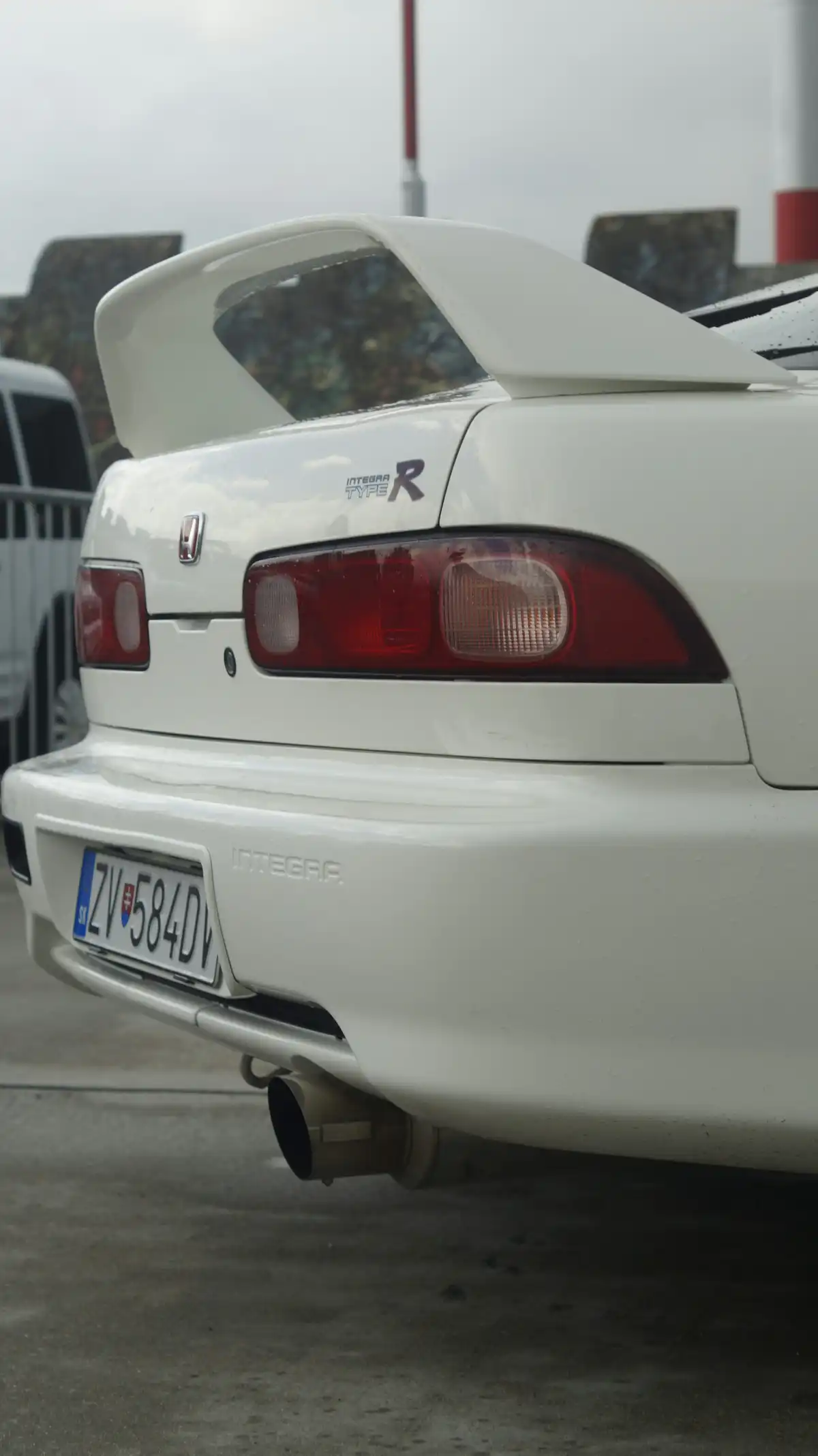 A white car parked in a parking lot