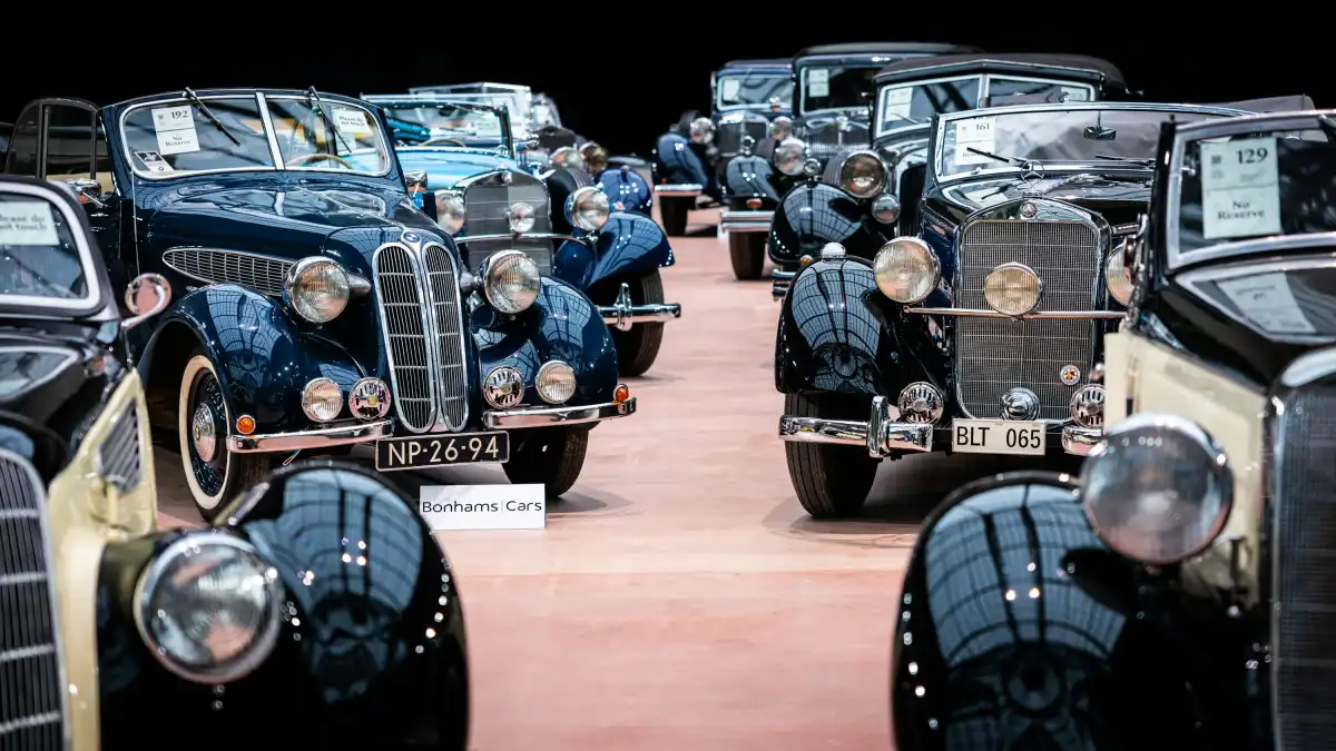 A group of old cars parked next to each other