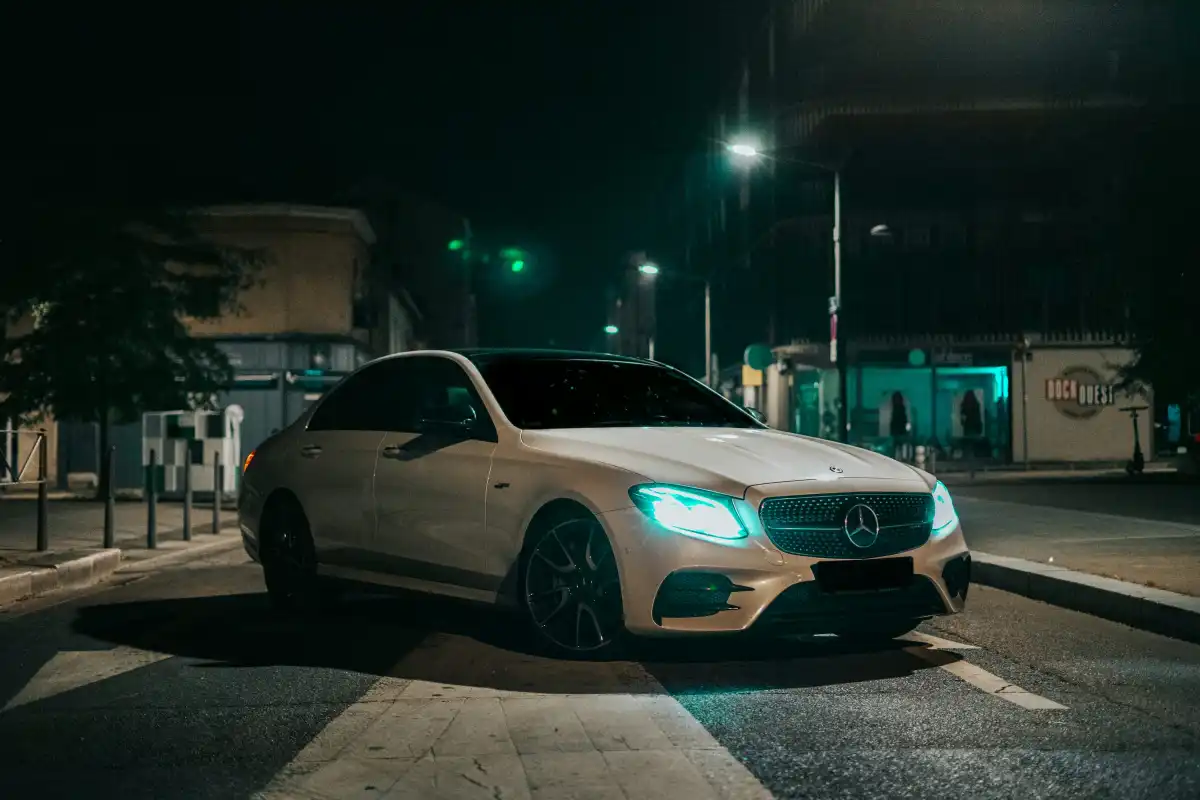silver mercedes coupe on road during night time