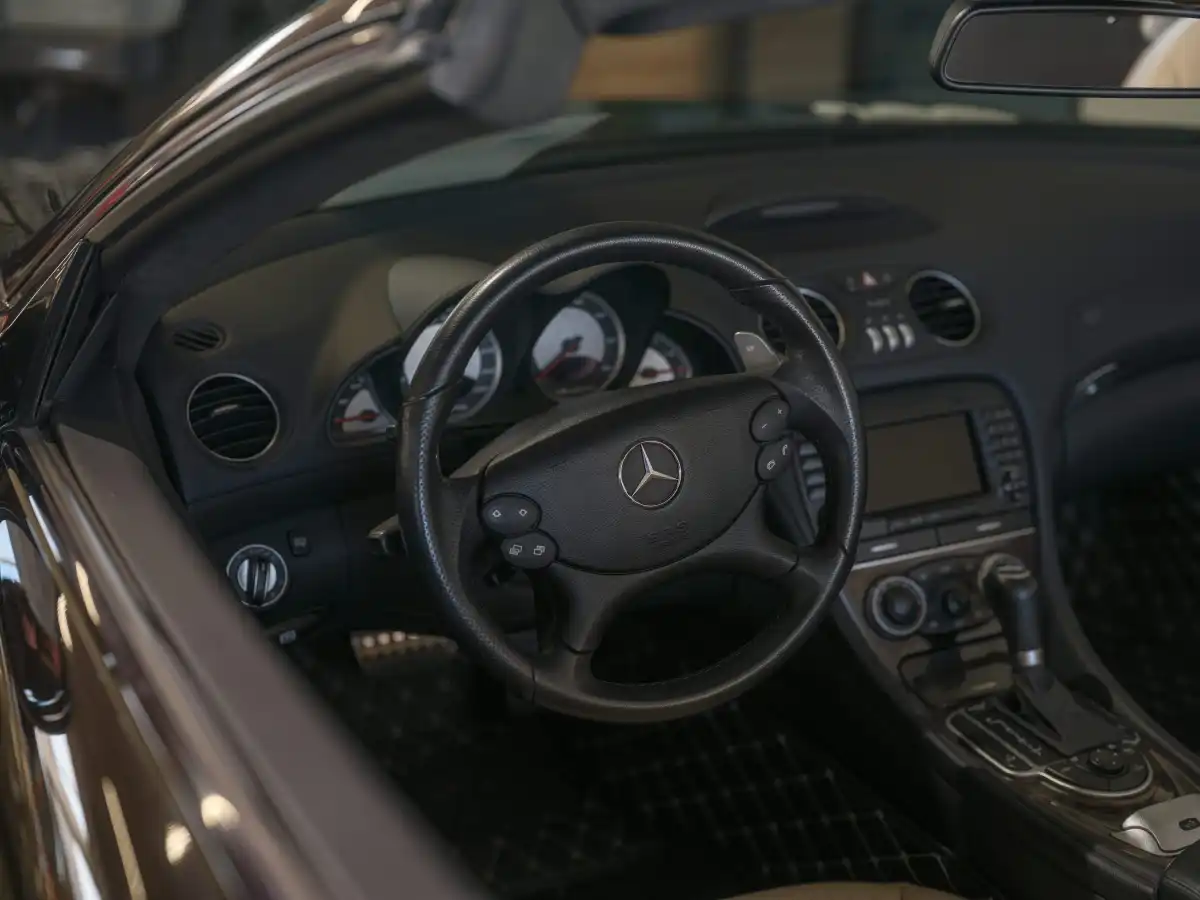 Mercedes-benz car interior with leather steering wheel.