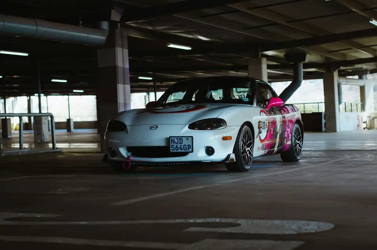 a white car parked in a parking garage