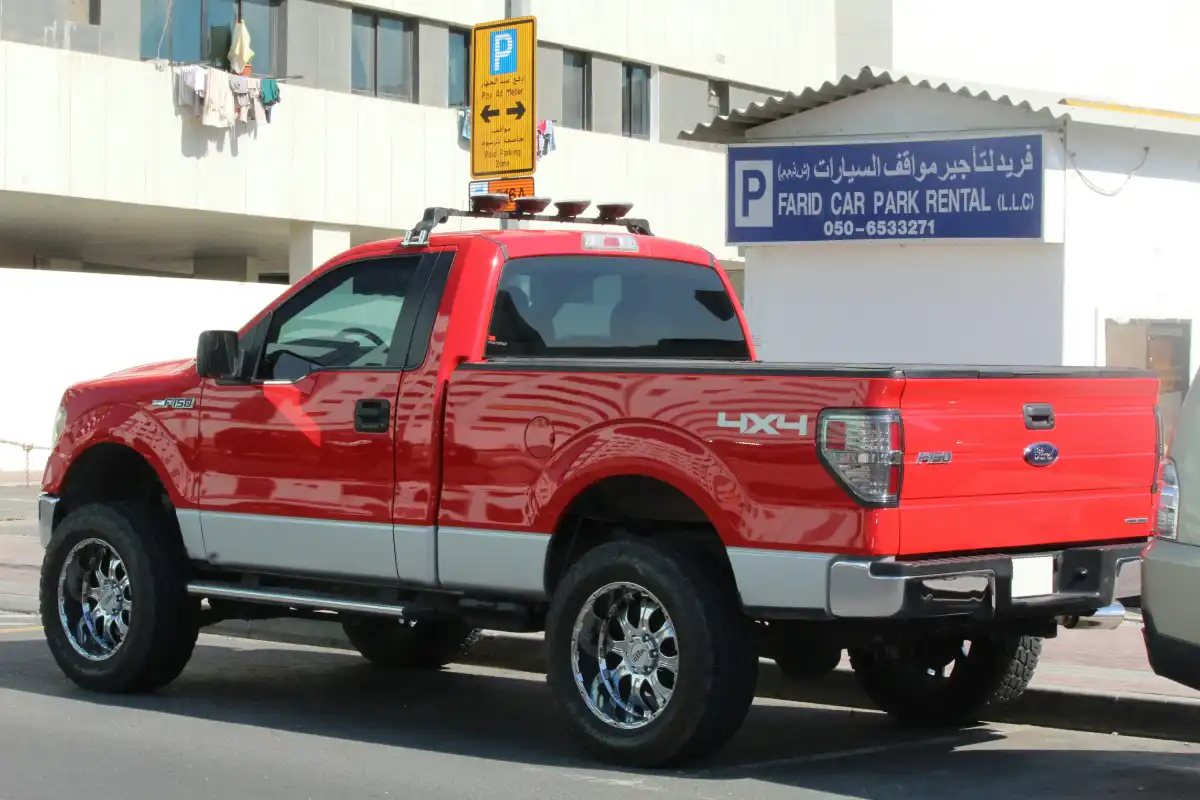 a red truck parked in front of a building