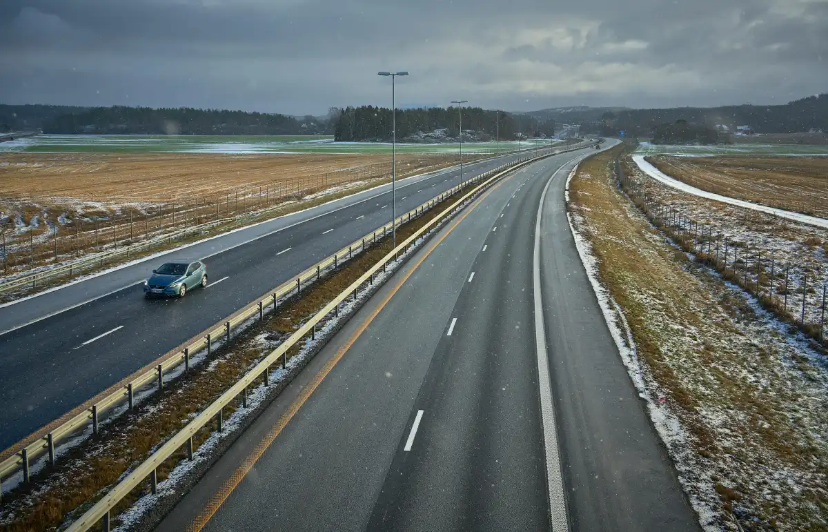 blue car on gray asphalt road during daytime