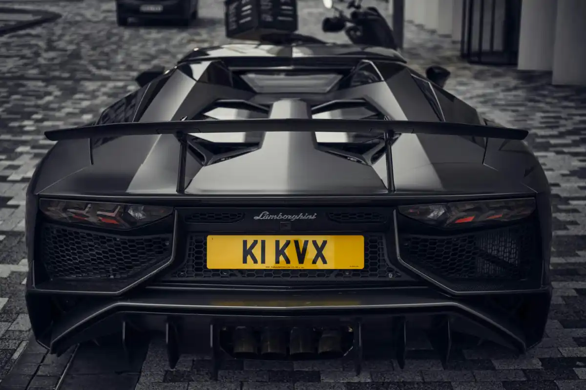 a black sports car parked in a garage