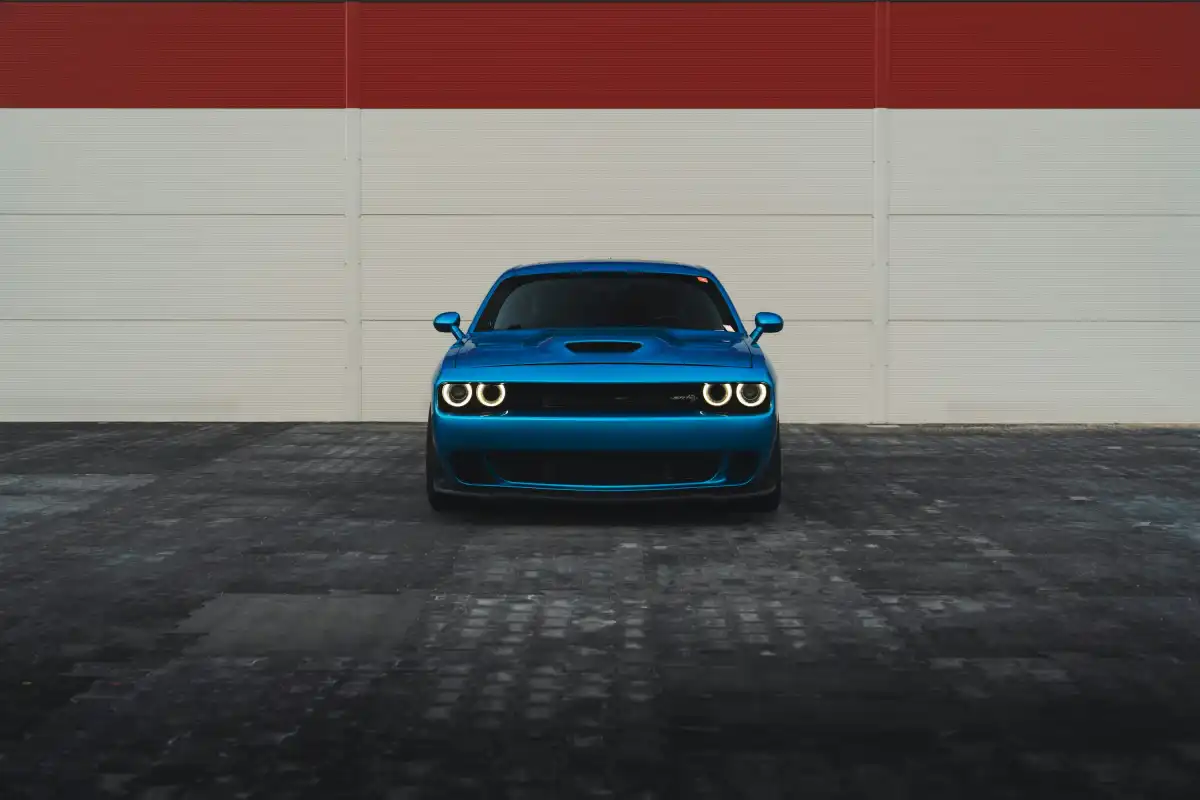 A blue car is parked in front.