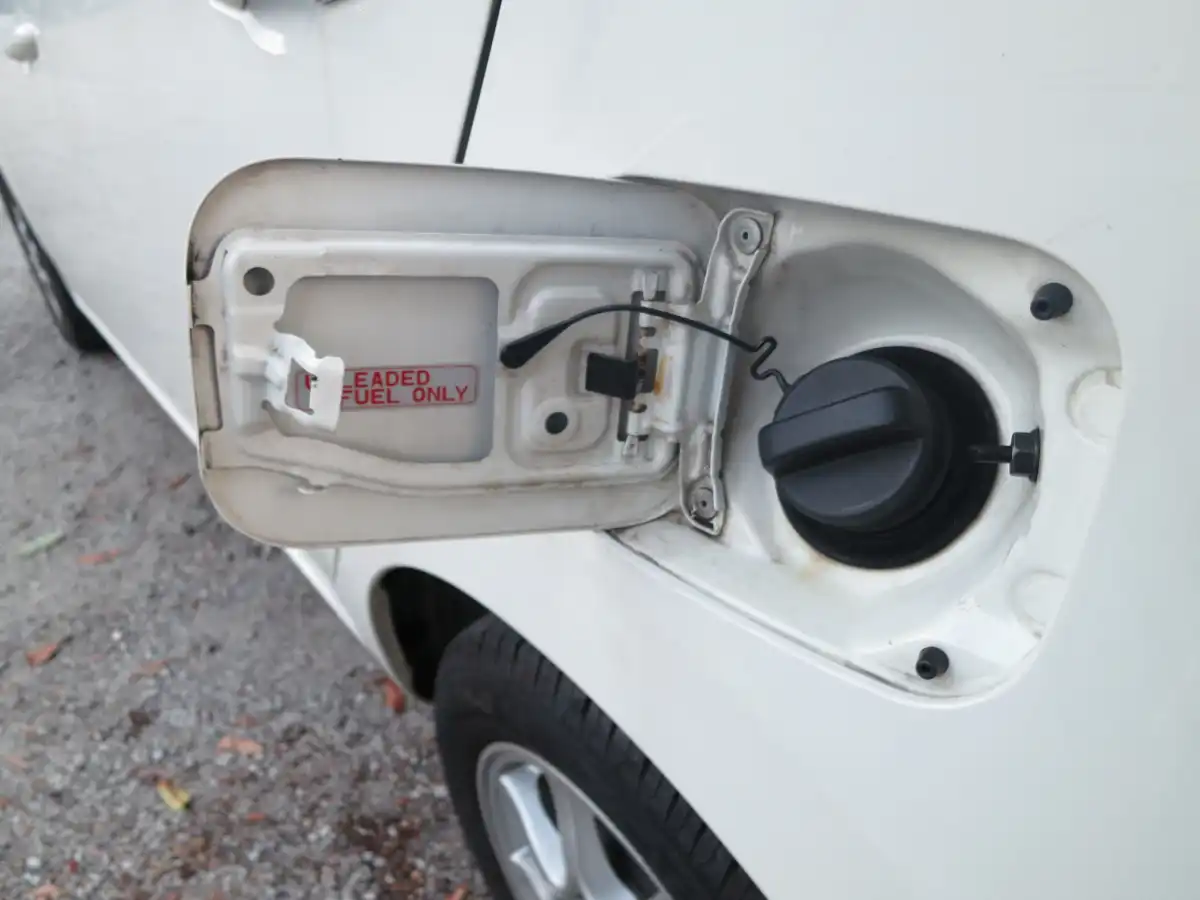 fuel filler door, unleaded fuel only