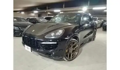 بورش كايان Turbo 4.8L (500 HP) WITH MANSORY CARBON BONNET, MANSORY CARBON INTERIOR AND MORE..