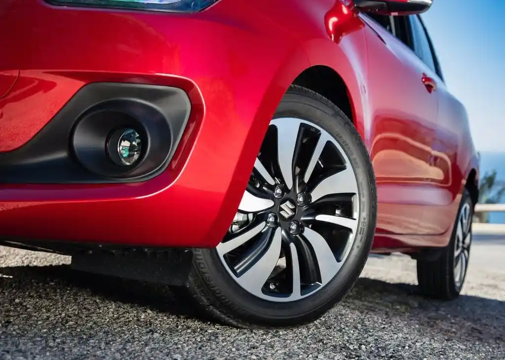 swift dzire on road price